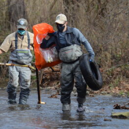 Volunteers come prepared to cleanup the stream.